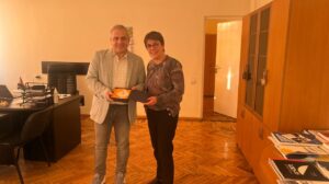 Man and woman holding a certificate