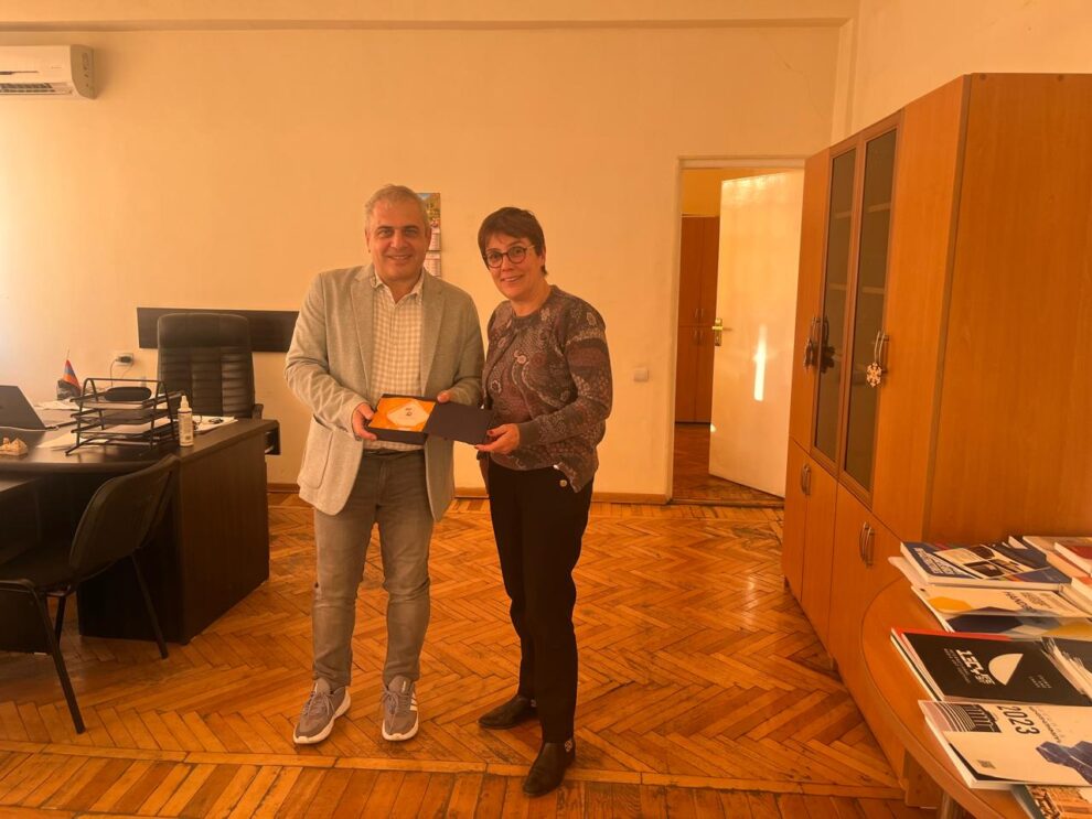 Man and woman holding a certificate