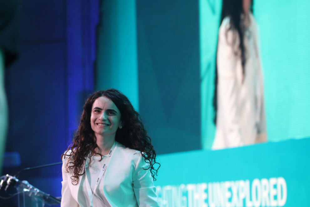 Smiling woman in white jacket