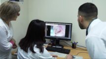 Doctors looking at a screen