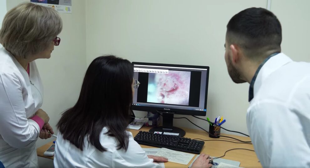 Doctors looking at a screen