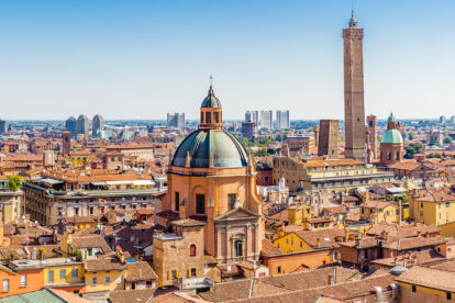 Aerial panoramic cityscape of Bologna, Italy, above rooftops of typical houses, ancient buildings and medieval towers