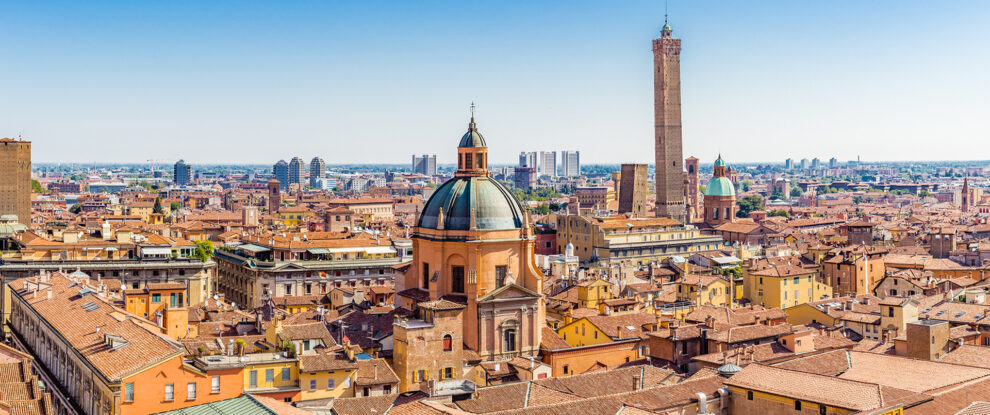 Aerial panoramic cityscape of Bologna, Italy, above rooftops of typical houses, ancient buildings and medieval towers